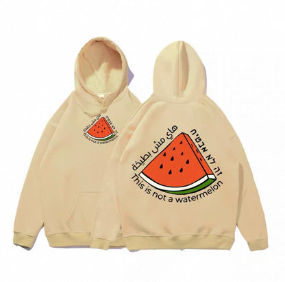 Beige hoodie med stor vandmelon og teksten “This is not a watermelon”