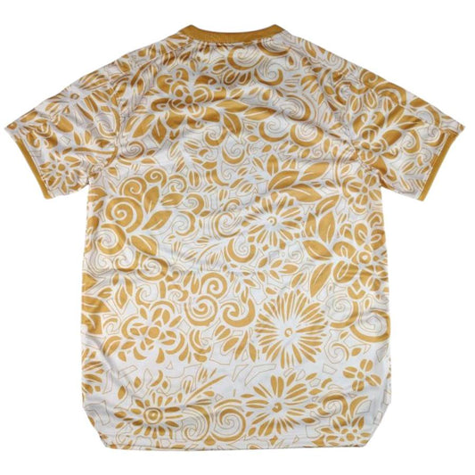 Bagside visning af FC Palestina fodboldtrøje med fuldt guldfarvet blomstermønster og artistisk design